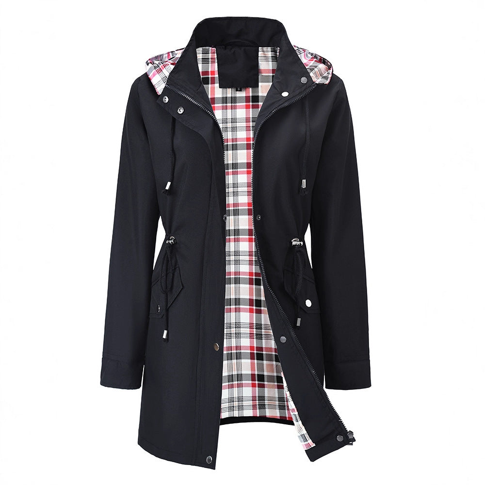 White women's hooded windbreaker with a tartan lining and drawcord waist