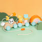 Three car wooden pull train with bead maze, stacking pegs and rainbow, cotton cord laid out in front
