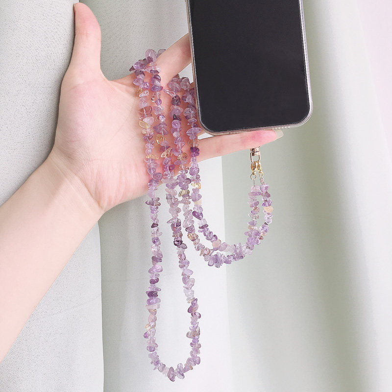 Top down layout of the beaded phone lanyard coiled with its clip closure
