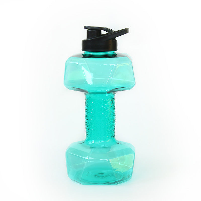 Fillable dumbbell water bottle lying on its side on a plain light background