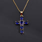 Cross pendant set with purple cubic zirconia on a delicate plated chain, studio shot