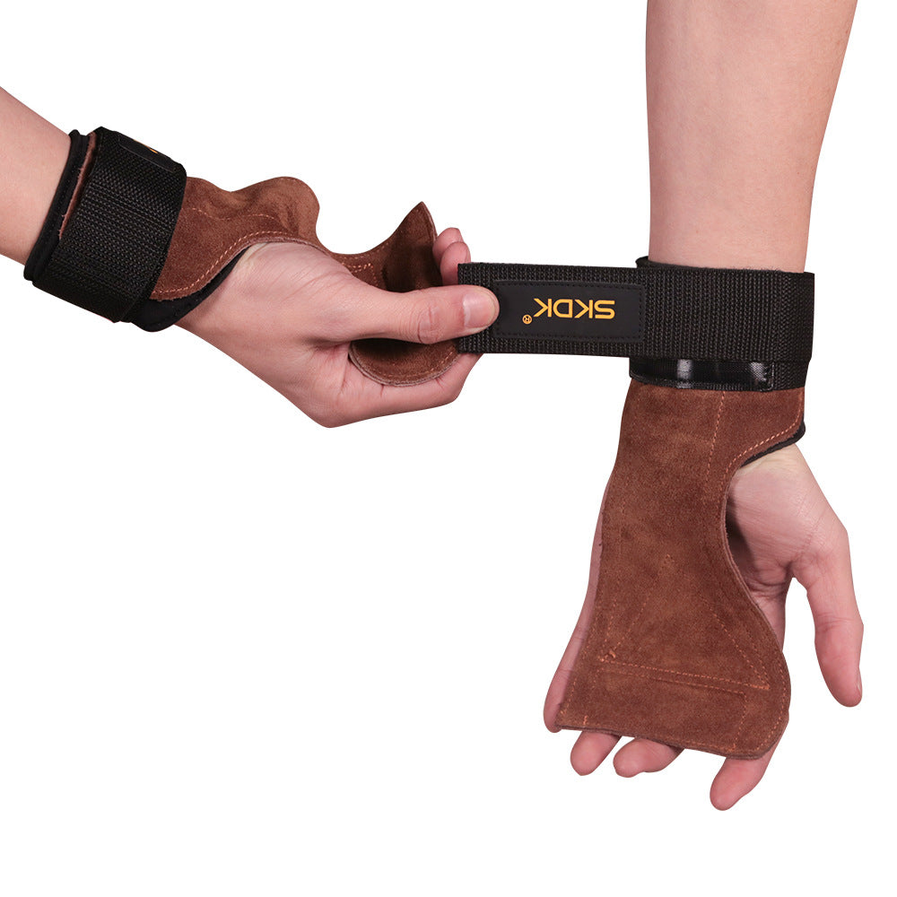 Weightlifting hand grip with a hook-and-loop wrist strap being fastened
