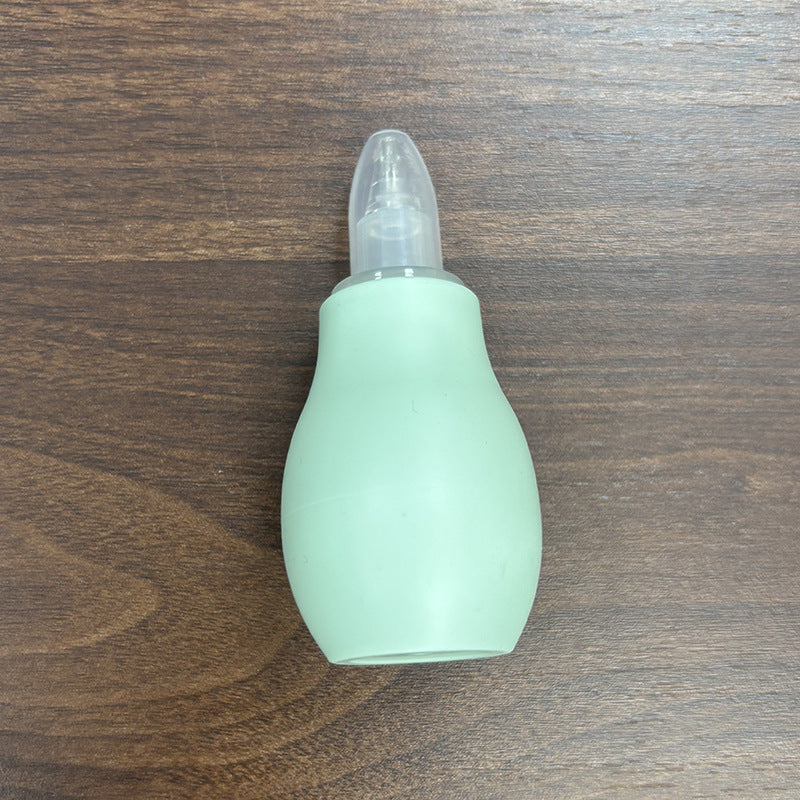 Brown and pink baby nasal aspirator bulbs with soft tips shown together on a pastel surface