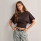 Back view of the batwing sleeve casual top showing the loose drape and gathered waist seam