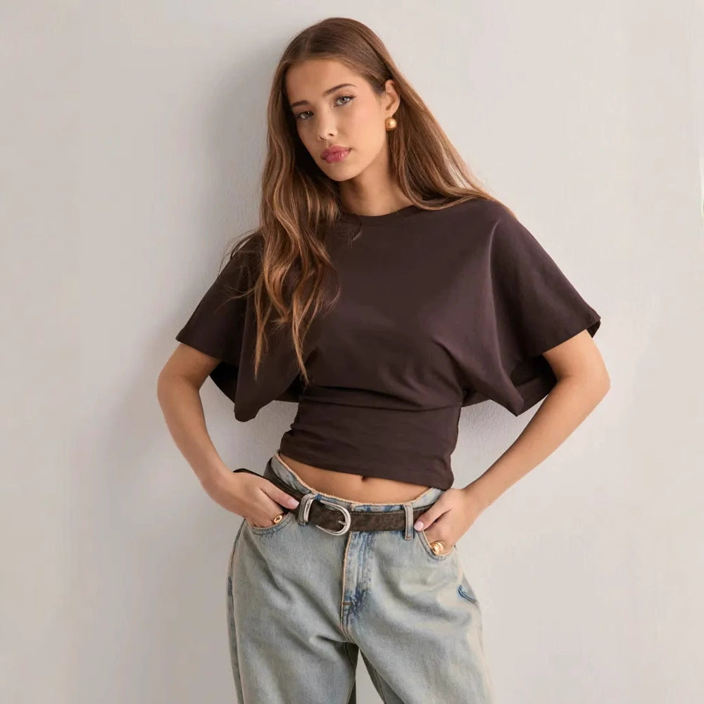 Back view of the batwing sleeve casual top showing the loose drape and gathered waist seam