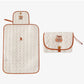 Quilted cotton changing pad shown folded with its design options overview