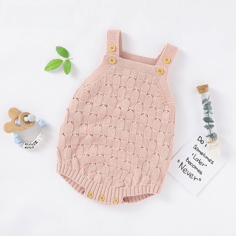 Close-up of the open pointelle knit pattern used in the sleeveless baby romper