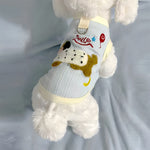 Sleeveless small dog vest with a back leash D-ring and a dachshund applique worn by a small white dog seen from behind