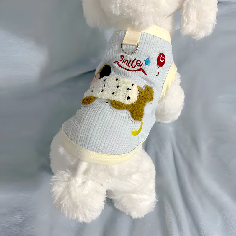 Sleeveless small dog vest with a back leash D-ring and a dachshund applique worn by a small white dog seen from behind