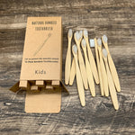 Bamboo toothbrush set shown with its packaging and presentation