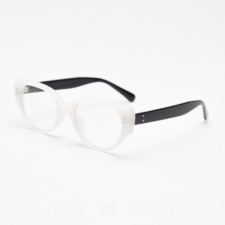 White frame with black temples and clear plain lenses at a three quarter angle