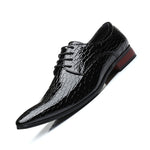 Black crocodile embossed pointed toe derby shoe with a red brown heel, side view on a white background