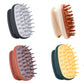 Four color range of elliptical silicone scalp shampoo brushes on a plain background
