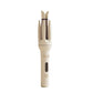 Cream automatic hair curler on white, open styling chamber and heat screen marked 150 to 210