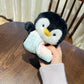 Small squishy bean bag plush animal toy on a shelf, gentle weight and cotton apron body