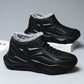 Pair of black molded high top winter boots with plush fleece collars, studio view
