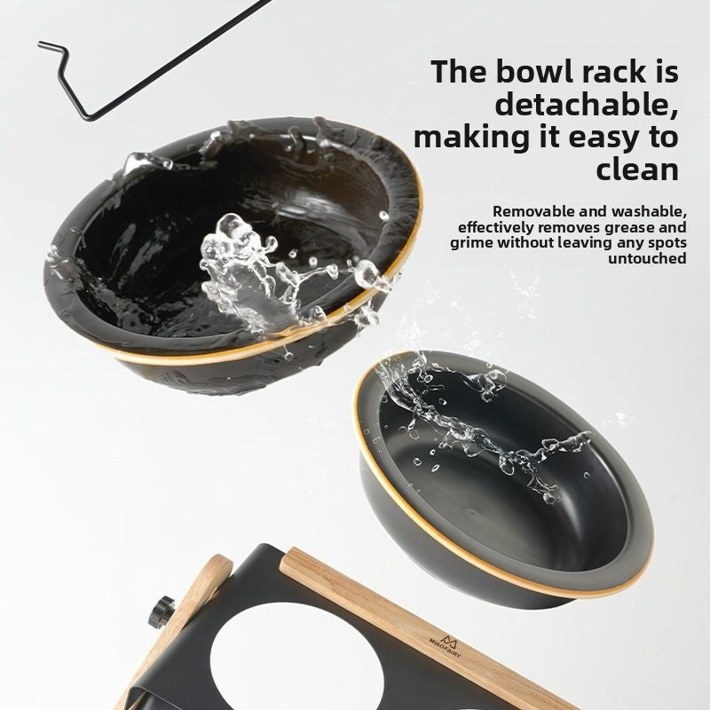 Two black ceramic bowls lifted out above the black metal tray of the double pet bowl stand, with water splashes