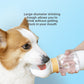 Corgi drinking from the wide fold-out trough of a white portable pet water bottle held in one hand