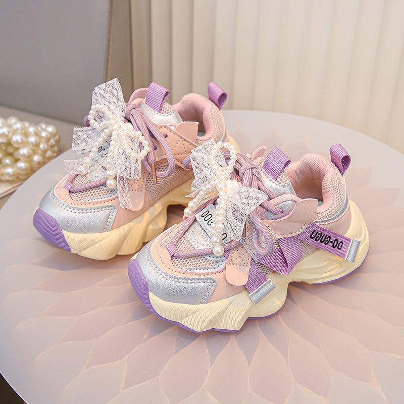 Close-up of the breathable mesh and knit upper on the girls' sneaker