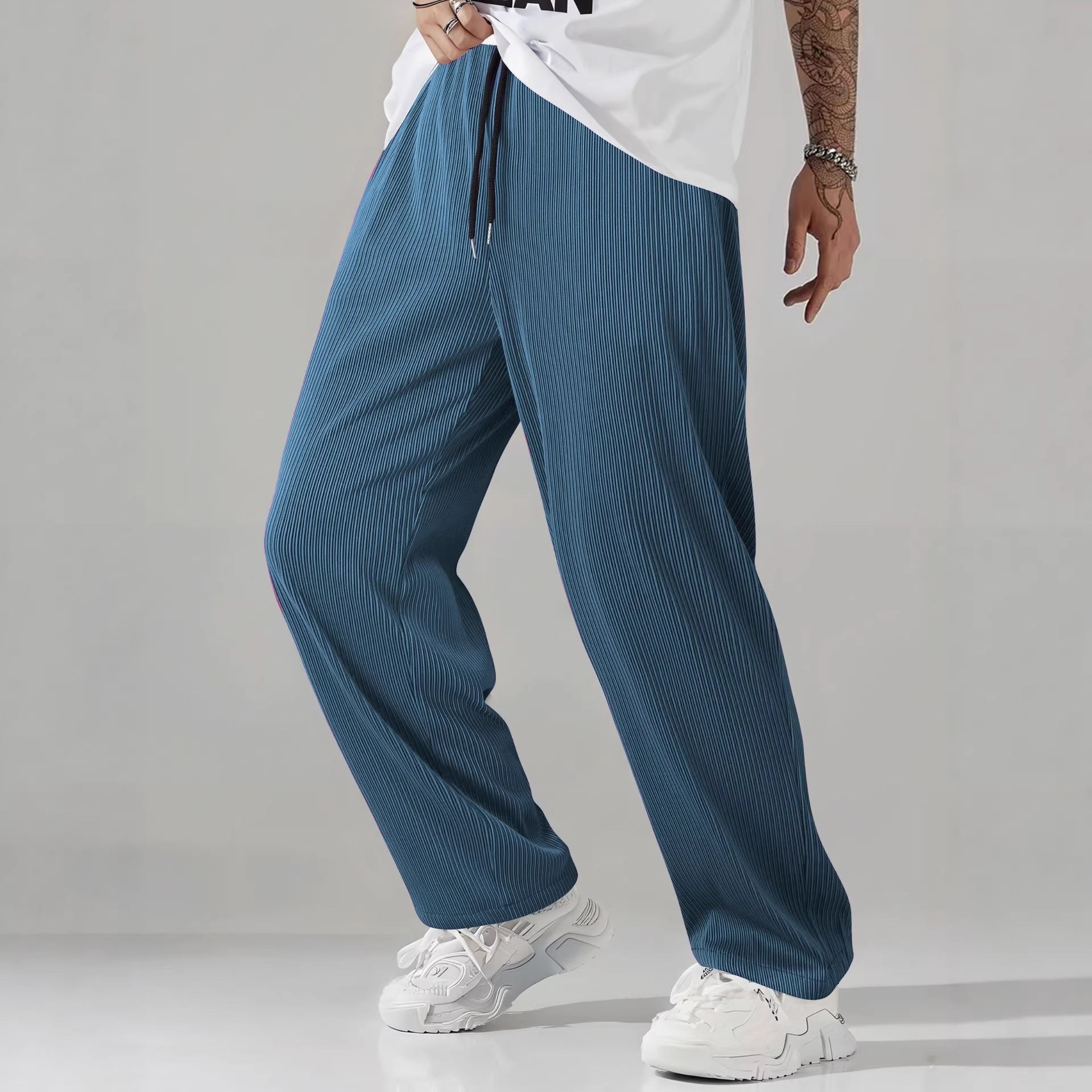 Sapphire blue pleated straight leg mens casual pants shown full length on a male model