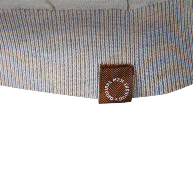 Angled view of the men's knit top showing the regular fit through the torso