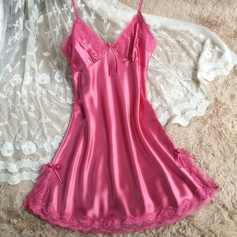 Raspberry pink satin slip nightdress with lace at the neckline and hem, flat on a lace cloth, option photo for size XL