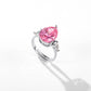 Pear cut pink stone with clear pear accents on an adjustable open shank, white background