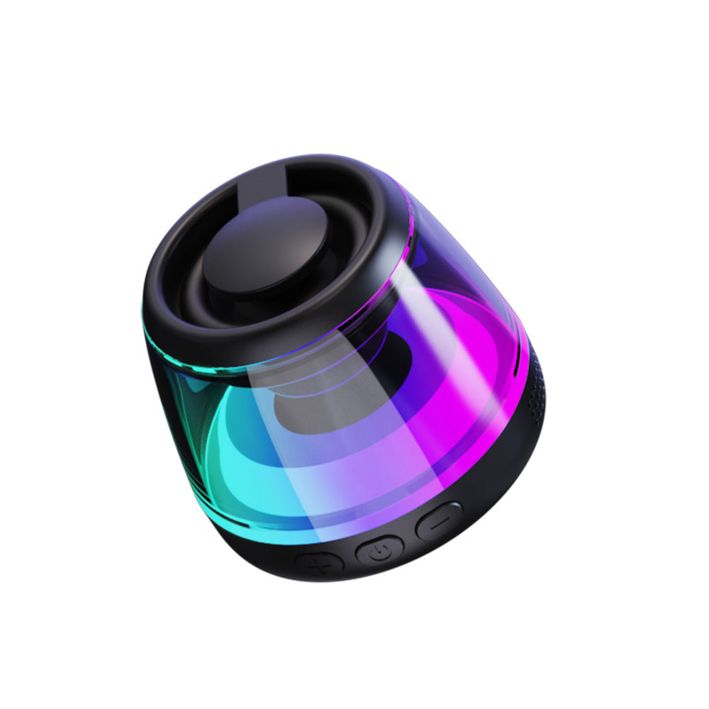 Black iridescent speaker angled to show the driver and the volume buttons
