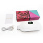 White heating belt beside a rose print box with a white USB cable and a thank you card