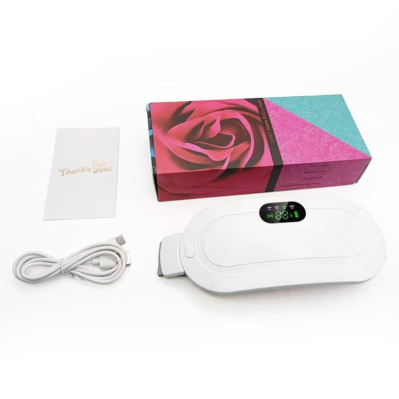White heating belt beside a rose print box with a white USB cable and a thank you card