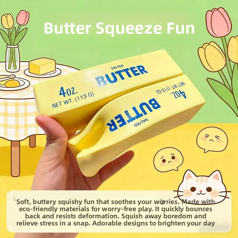 Hand holding two pale yellow butter stick squishy toys, one bent, in front of a butter squeeze fun illustration