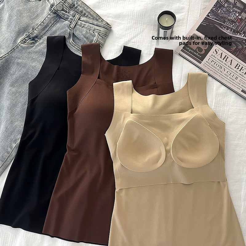 Nude seamless tank top turned to show the built-in fixed chest pads, with black and brown tops behind it