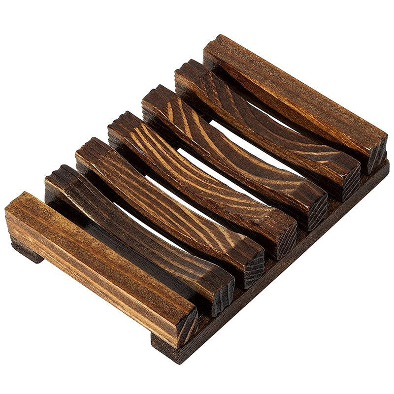 Charred pine wood slatted soap rack with dark brown grain on a white background