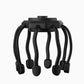 Black scalp massager with eight flexible claws and a round top without a carry loop