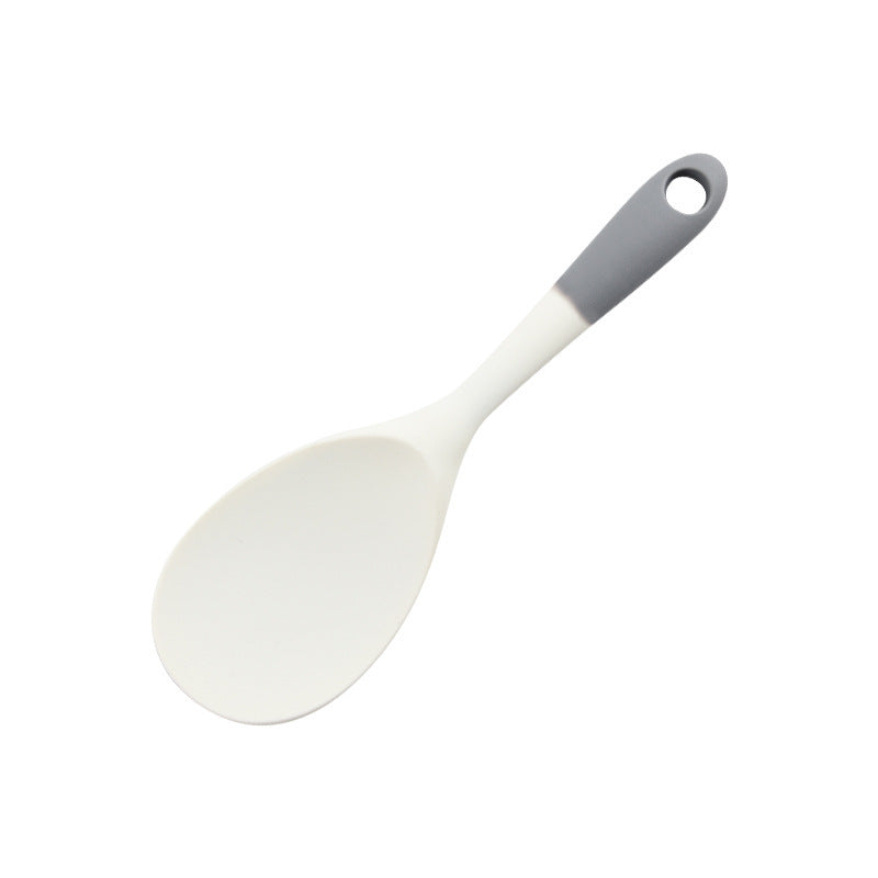 Gray and white silicone rice paddle with a rounded head and a hanging hole on white