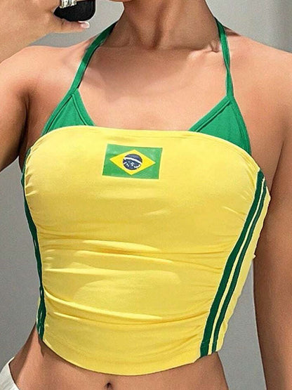 Yellow halterneck crop top with green trim and Brazil flag worn front view