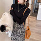 Ribbed mock neck long sleeve knit pullover shown on a model in a soft macaron color