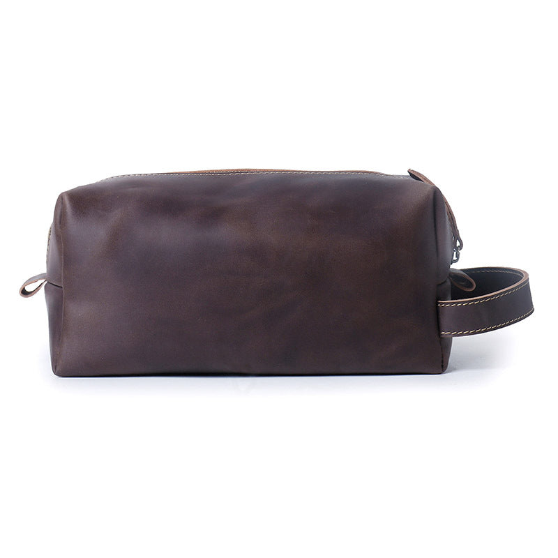 Dark brown leather dopp kit contrast cream stitching and seam close up
