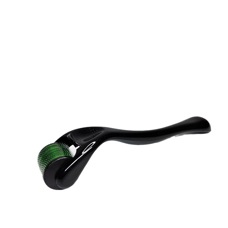 Black handle micro needle dermaroller used across the forehead in a skincare routine