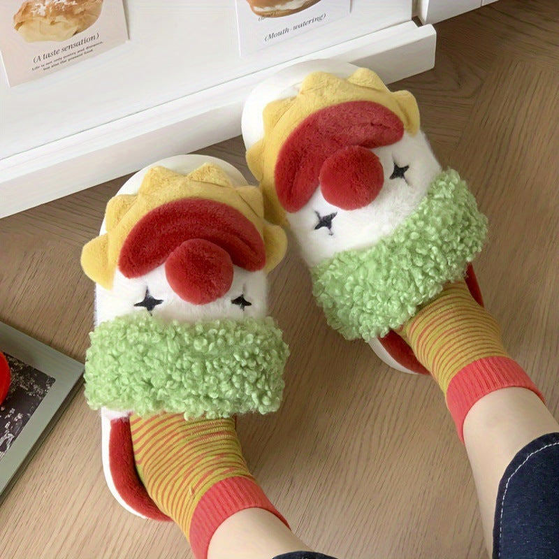 Top view of clown face slippers with star eyes and red pom nose worn over striped socks on a wood floor