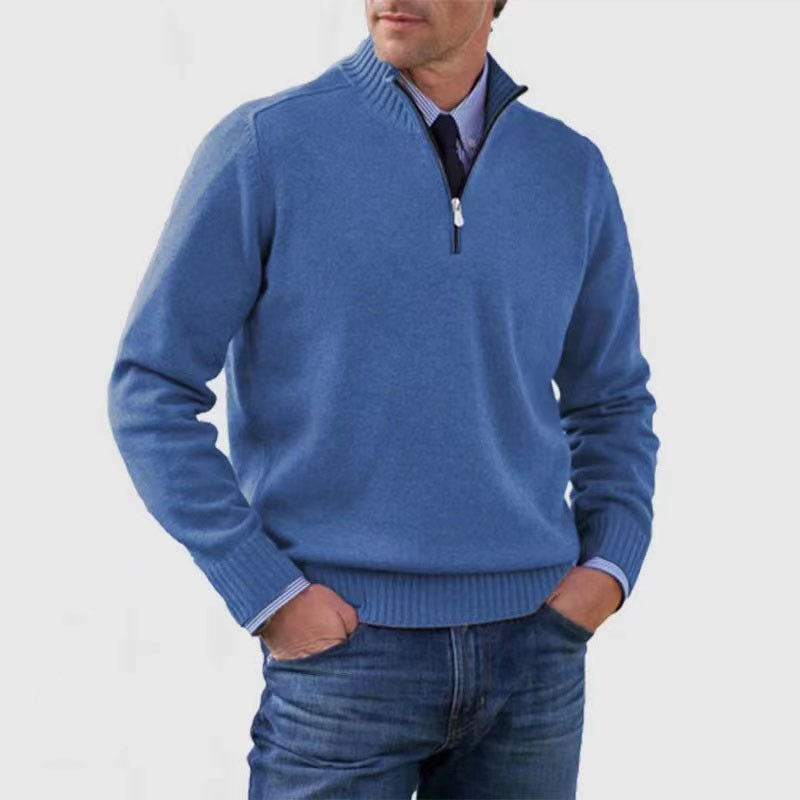 Blue mens acrylic knit quarter zip stand collar pullover sweater worn by a standing male model