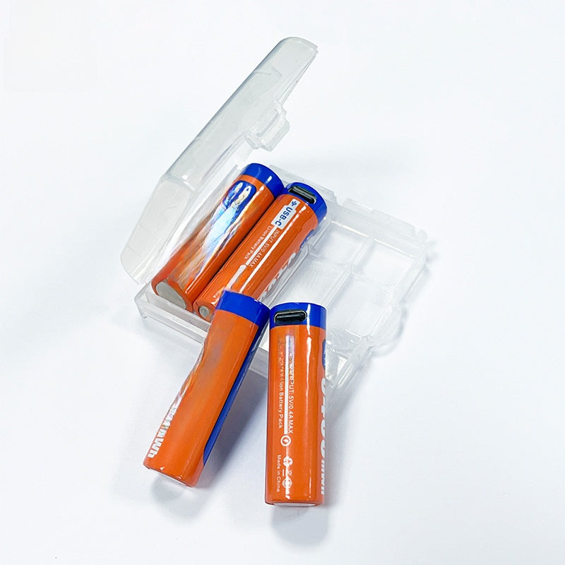 Orange rechargeable lithium battery with a USB-C port in its blue cap lying beside an open clear case