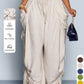 High waist wide leg linen look viscose drawstring trousers, the soft viscose linen look fabric close up