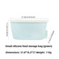 Reusable green silicone food storage bag, 400ml size, standing sealed upright