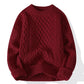 Cable knit crewneck pullover shown flat to display the full cable twist pattern