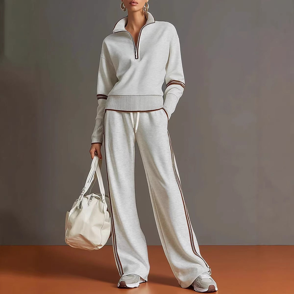 Two piece White sweatshirt and pants set, brown piping on the collar, cuffs and side seams