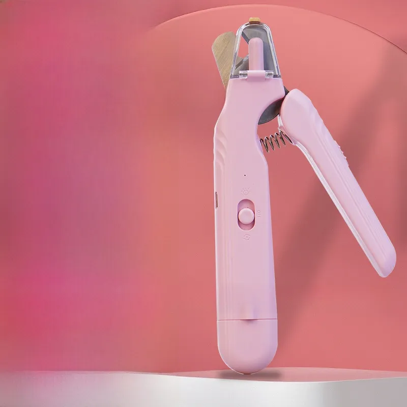Pink pet nail clipper with clear guard and speed switch on a pink studio background