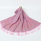 Pink paisley jacquard scarf spread on a white background with twisted pink tassel fringe