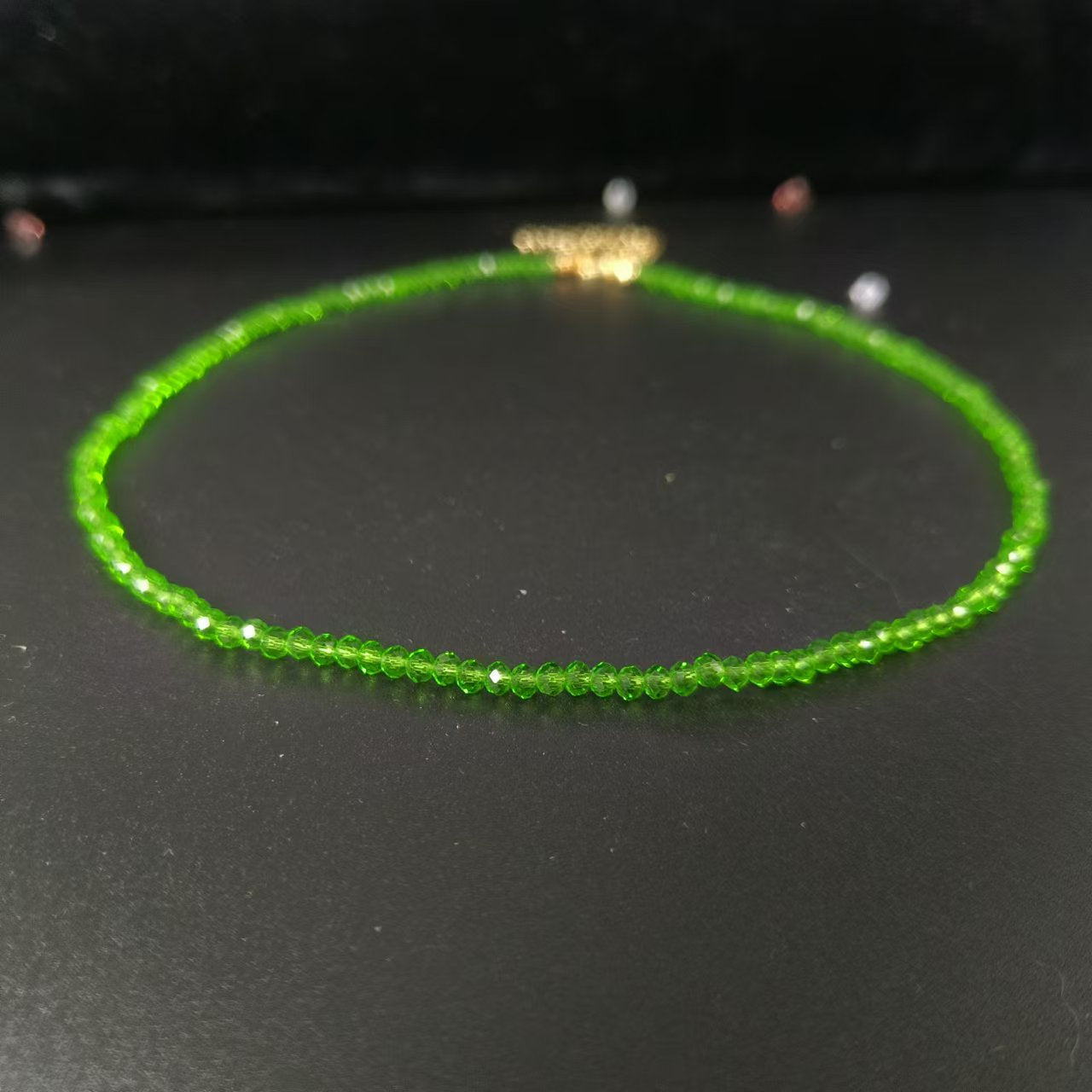 Gold tone lobster clasp and extension chain at the back of the bead necklace