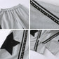 Star patch drawstring pants side profile showing relaxed tapered leg shape